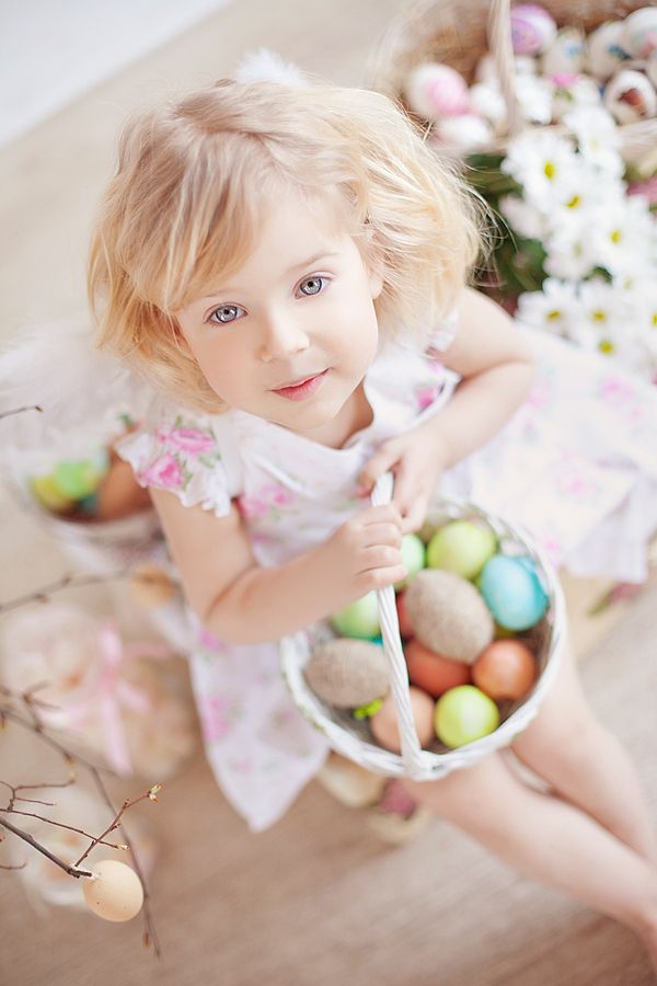 Cute Girl with Easter Egg Basket. All you need to do is snapping some cute pictures to commemorate the Easter. The lovely girl holding the Easter egg basket with charming smile is a very nice choice.