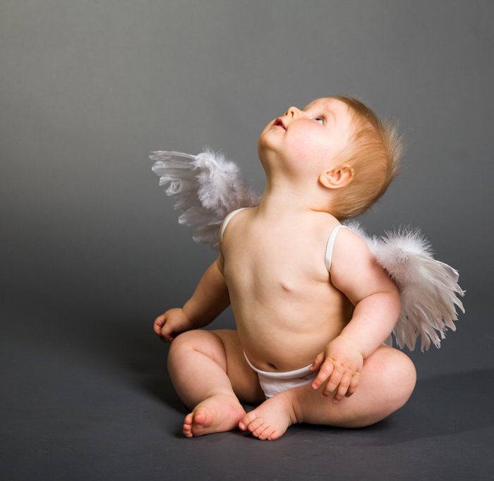 Sweet Christmas photo of a baby dressed up in angel wings