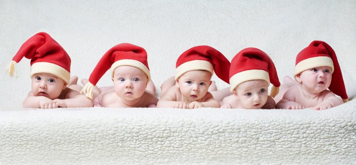 Cute Baby Christmas photo shoot of five babies in Santa hats