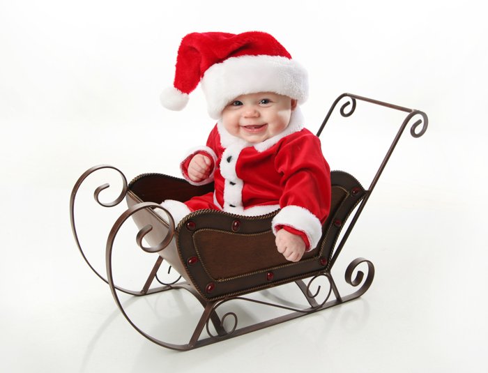 Sweet Christmas photo of a baby dressed as Santa Claus