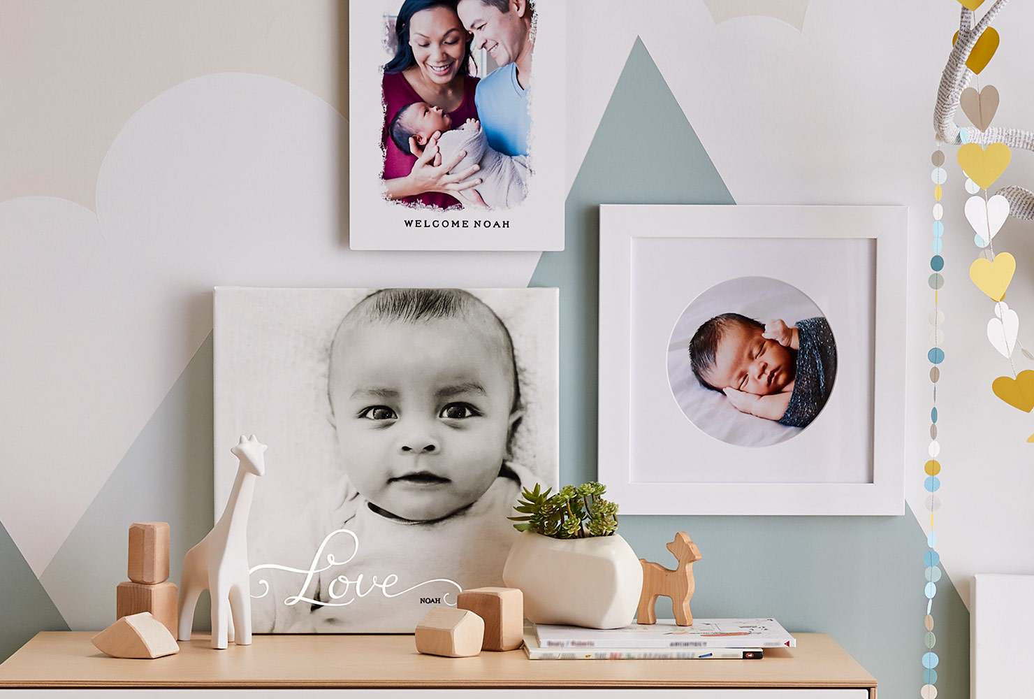 Newborn photo prints in nursery with colorful decor