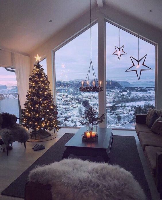 Aesthetic Christmas wallpapers iPhone with decorated Christmas tree, penthouse view and snow