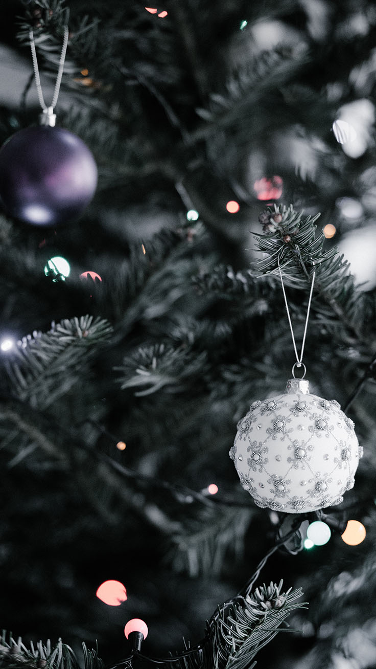 White baubles and decorations on Christmas tree wallpaper