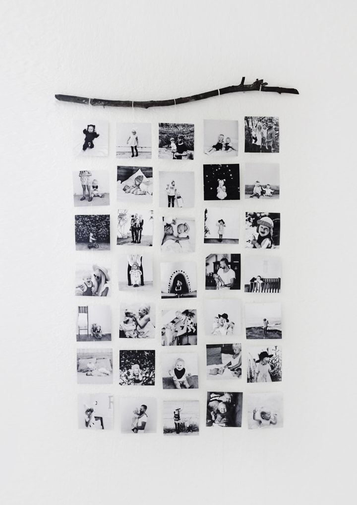 black and white photos hanging from a stick