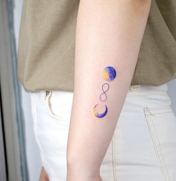 infinity symbol with colorful watercolor half-moon and full moon tattoo