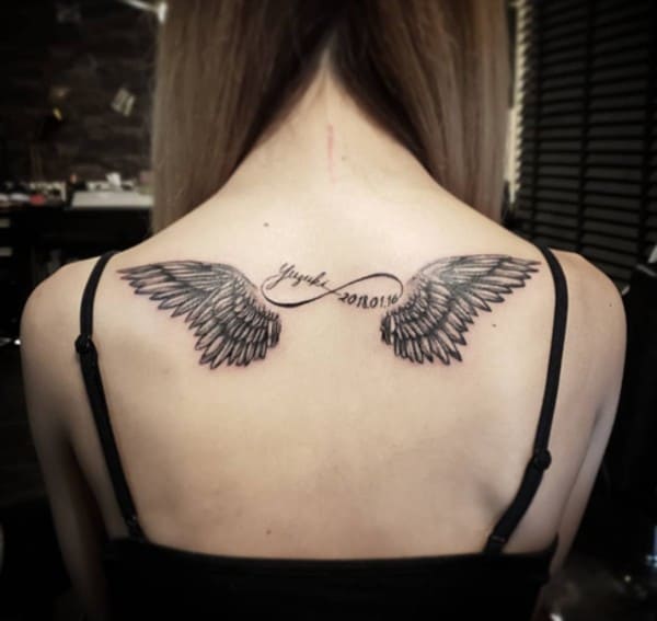 infinity tattoo with angel wings on back