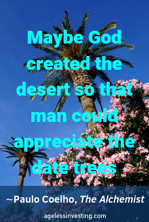 A palm trees and flowers and a blue sky. Headline quote, "Maybe God created the desert so that man could appreciate the date trees." -Paulo Coelho, The Alchemist