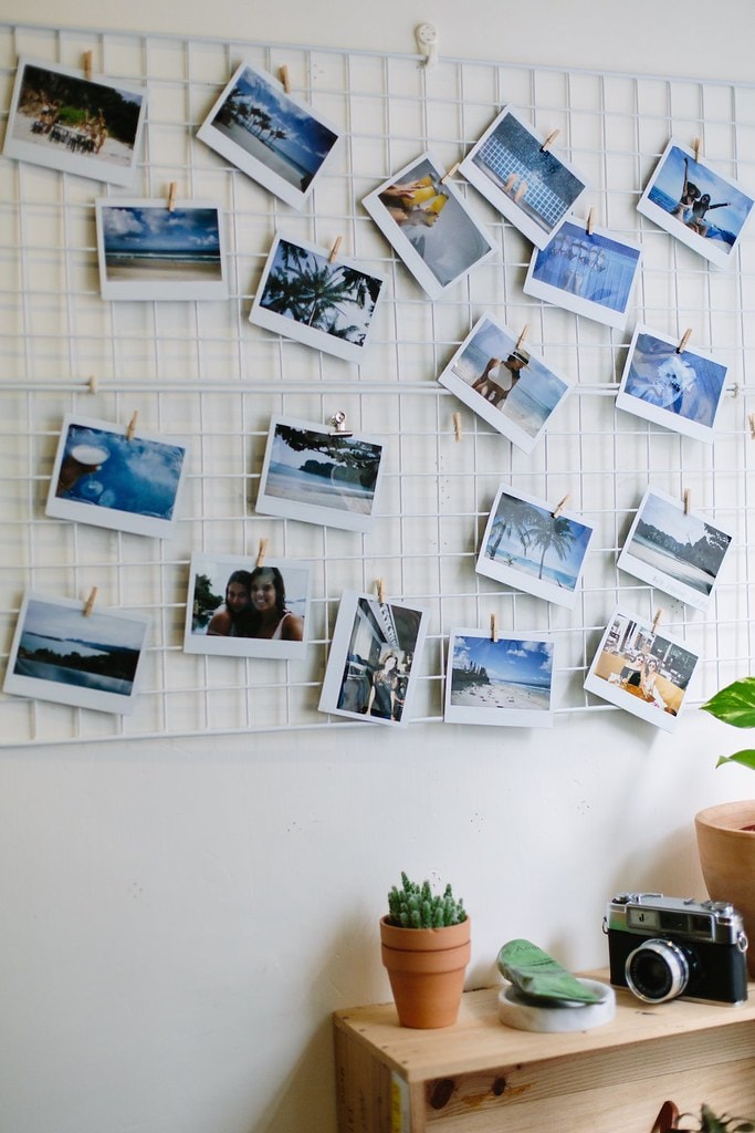 Photo wall ideas - images hanging on a mesh board