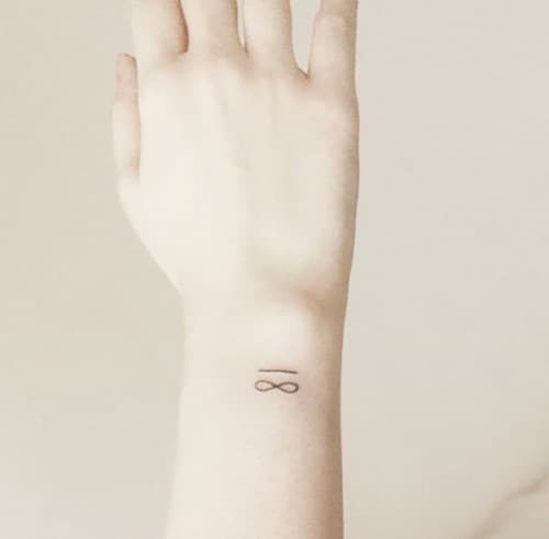 minimal infinity tattoo on wrist