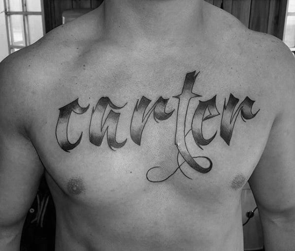 shaded black and grey carter kids name male upper chest tattoo