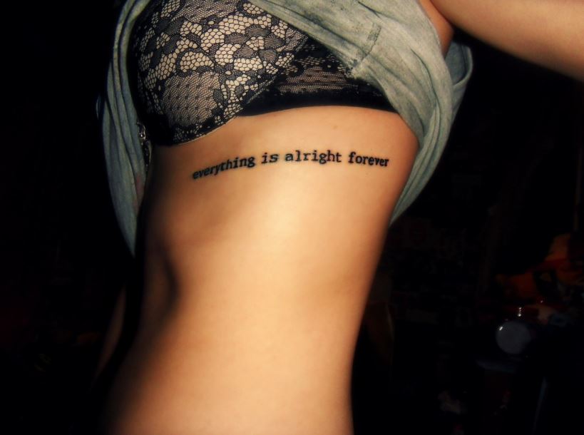 Short Quote Tattoo On Girl Rib Cage