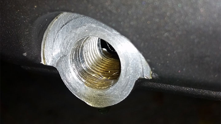 stripped oil pan drain hole
