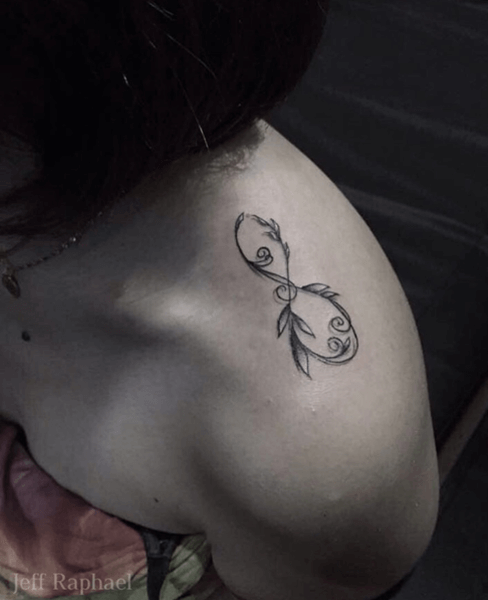 tattoo with leaves on shoulder